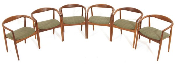 In the Manner of Hans Wegner: Curved back dining chairs, set of six, Teak, upholstery. Size 23.5W x 19D x 28H. Seat 17.5H