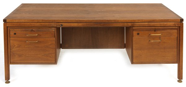 Jens Risom: Executive desk, Jens Risom Designs. Five drawers, Privacy panel. Original label. Walnut, brass. Size 81W x 36D x 29H.