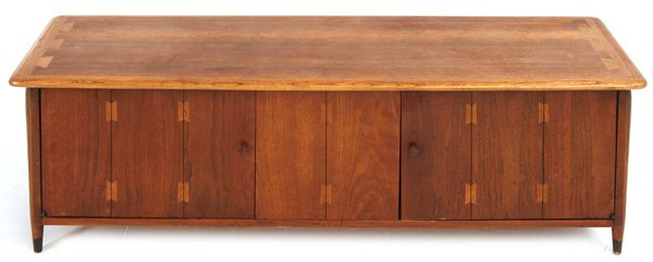 Andre Bus: Rare four door console. Signature dovetailed top. Walnut. Branded manufacturer's mark to underside. Size 60W x 18D x 18H.