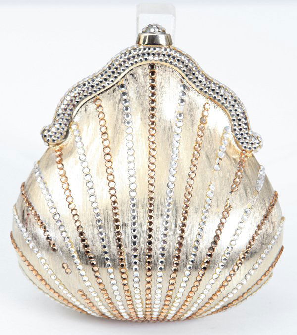 Judith Leiber: Gold Minaudieres in shape of shell, includes mirror, comb and strap. Missing some rhinestones 1980's