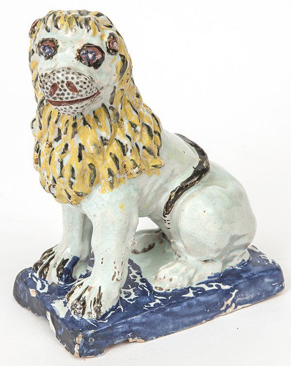 French Tin Glazed Earthenware Lion: circa 1st quarter of the 19th century, a seated male lion in hand painted polychrome tin glaze on a buff colored earthenware body, 3.25 x 5.7 x 7.5" high.