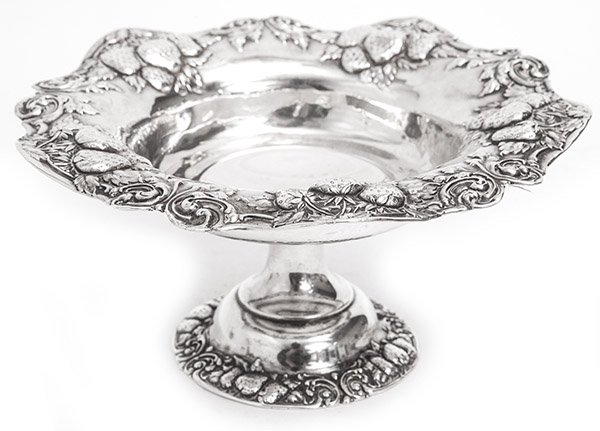 William Whiting Sterling Compote: Scalloped border compote with embossed strawberry and floral pattern. Pattern on base. Manufacturers mark to underside, Sterling #1486 Approx. weight 6 ozt. Size 7.25 x 7dx 3.5h.
