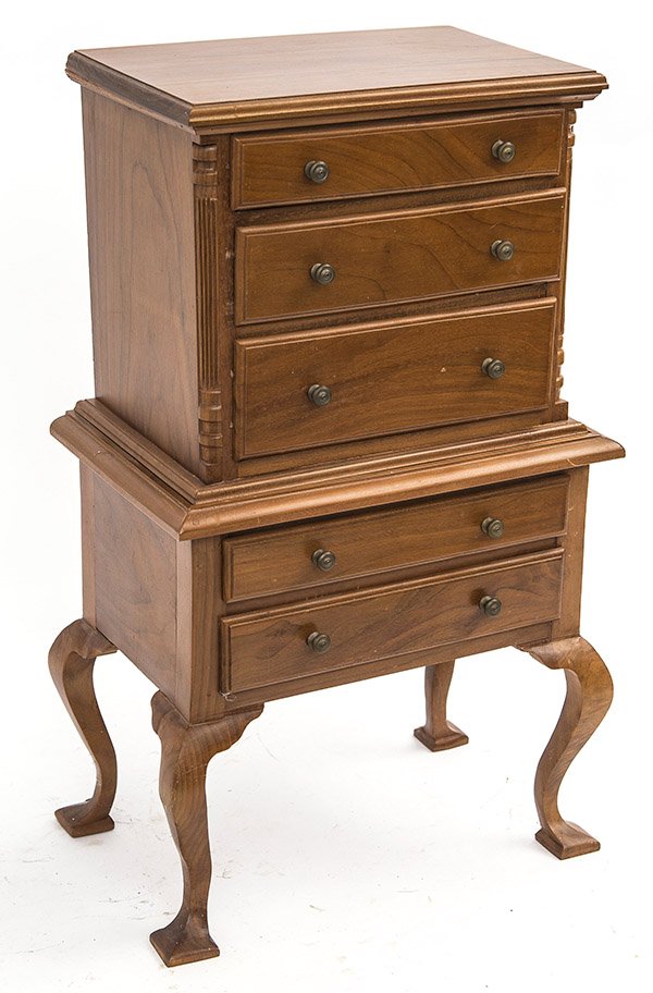 20th Century Miniature Chest on Stand: Fine 20th Century two piece chest on stand, molded cornice, above three long graduated drawers. Two embossed corner fluted columns. The base has two long drawers resting on cabriole legs, resting on s
