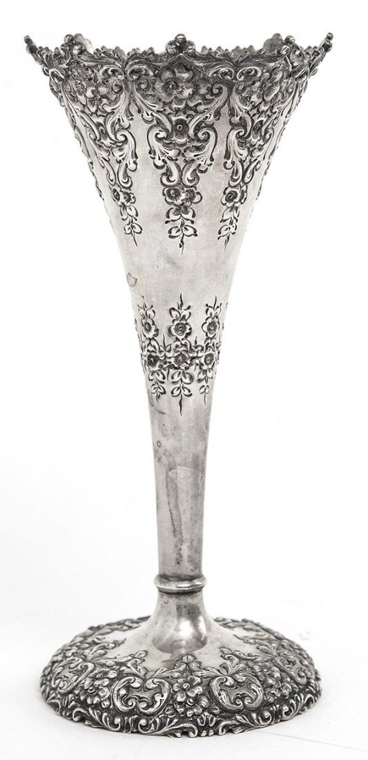 Duhme and Co. Sterling Repousse Vase: Sterling vase with floral border and footed base. Manufacturer's mark to underside. Approximate weight 4 ozt. Size 7"h