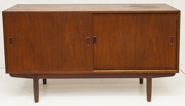 In the Manner of Arne Vodder: Cabinet, two doors concealing storage. 1950's Denmark. Teak Size 59w x 18d x 34h
