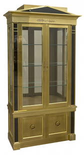 Mastercraft Vitrine: Outstanding Vitrine, Neoclassical style with architectural cornice continuing to two paneled doors with beveled glass. Three glass shelves with illuminating interior, flanked by tinted glass