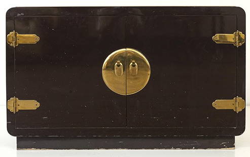 Mastercraft Server: Two door cabinet, 1970's. Lacquered wood, brass, Asian accent hardware. Manufacturer's label to verso. 48w x 13 1/2d x 30h