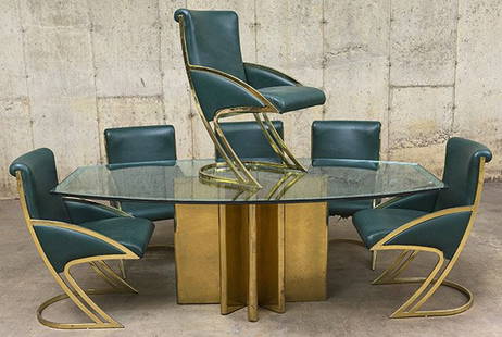 Milo Baughman Style Dining Table and Chairs: Dining table, beveled glass top with silvered bevel and heavy prong base. Brass, silvered beveled glass. Set of six dining chairs, sculptured base. Leather, brass. *Please note you are buying the
