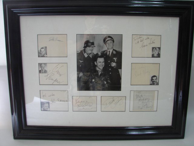 Hogan's Heroes Autograph Display: Framed Hogan's Heroes cut autograph display, center photo w/8 cut signatures, signed in pen of cast members, approx 32in x 24in