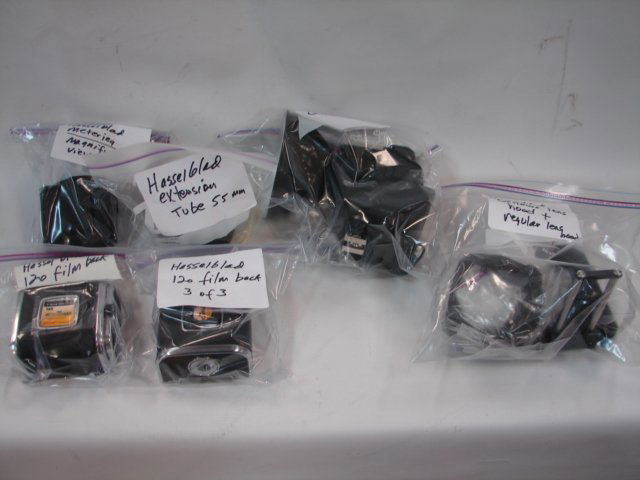 Lot of Hasselblad Accessories, 6pcs: Hasselblad D Flash 40, 120 Film Back (2 pcs), Metering Magnifying View Hood, 55mm Ext Tube, Bellows Lens hood, etc