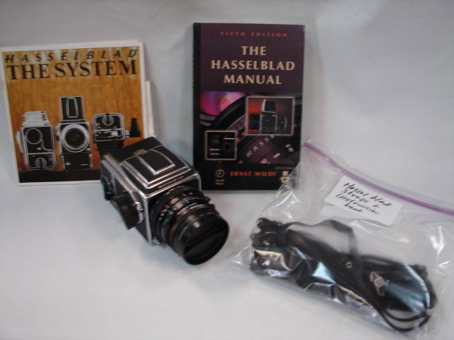 Hasseblad 500CM w/80mm 2.8 lens: Hasselblad camera w/120 film back & straps, instruction booklet & manual