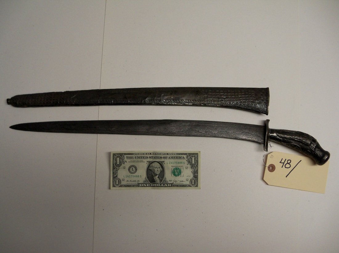 Antique 19th Century Indonesian Pendang Short Sword: This example is silver mounted with proto-European design motifs likely originating from Dutch tradewares. inch blade. William Herbert McGinty Collection. Collected between the late 1800's and early 1
