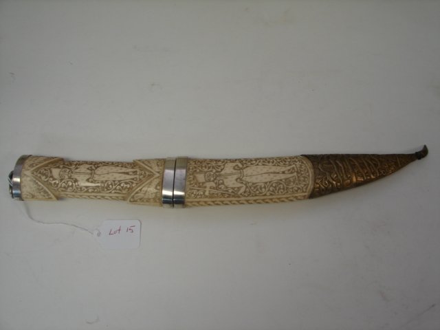 19th Century Indian Belt Dagger: Indian Belt Dagger, 19th C, heavily carved w/silver fittings, 16" overall, blade 7" , from The William Herbert McGinty Collection. Collected between late 1800's and early 1900's