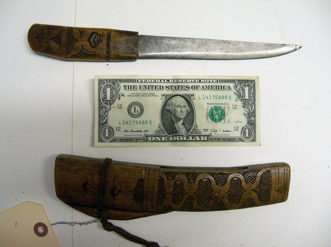 Antique 19th Century Japanese Ainu Tanto Dagger: They were carried by Ainu tribesmen from Northern Japan and were often carved in designs quite different from standard Japanese iconography. This example is carved en suite with Ainu motifs. From the