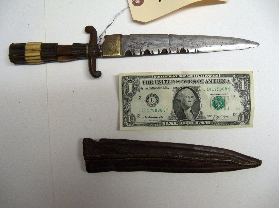 19th Century Tuareg or North African Dagger: In the shape of an early Spanish Dirk. This example has a crossguard with a multi-sectioned ebony and ivory grip. The William Herbert McGinty Collection. Collected between the late 1800's and early 19