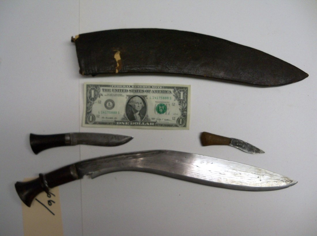 19th Century Nepalese or North Indian Kukri Knife: With small side knives and wooden handle. The Kukri is the national knife and principal weaponof the Gurkas of Nepal. From the William Herbert McGinty Collection. Collected between the late 1800's and