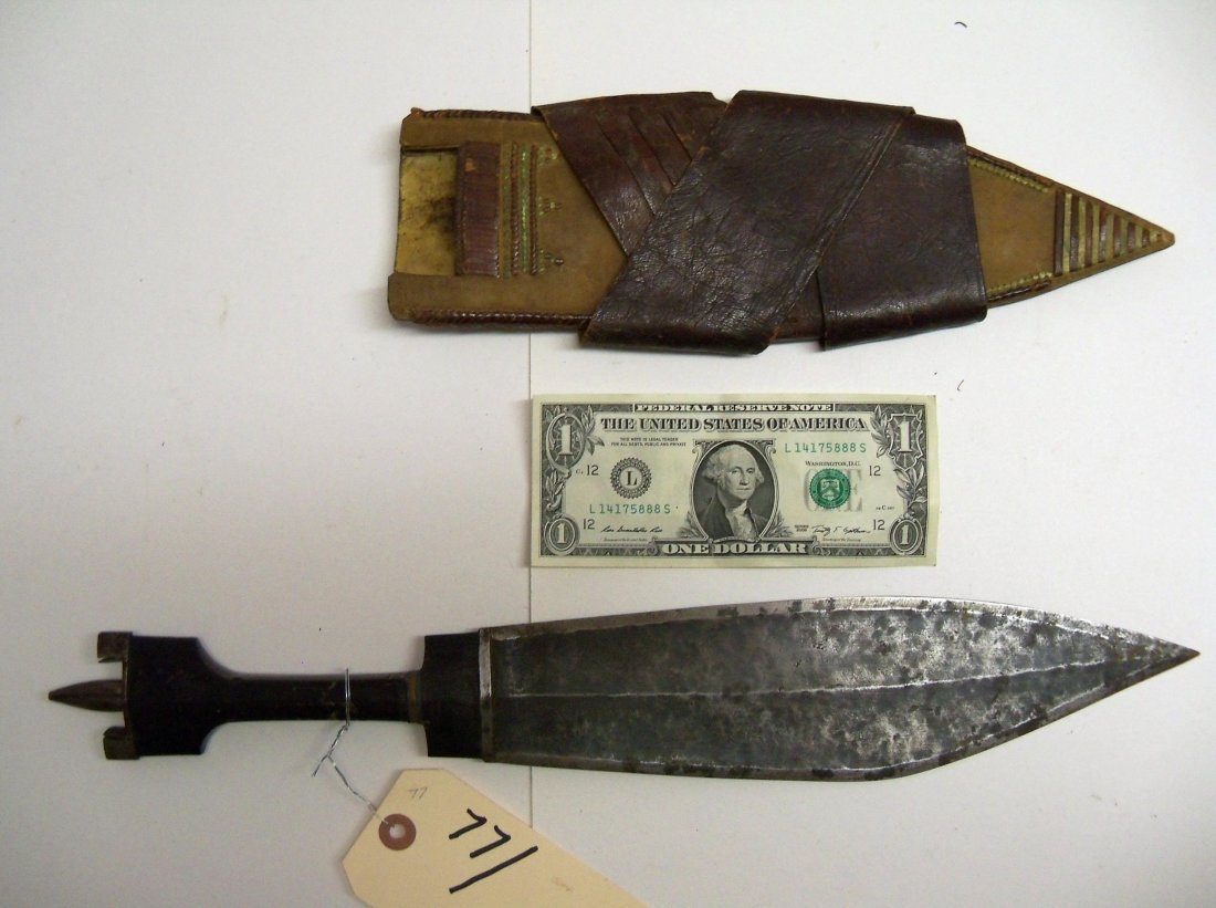 19th Century Antique Somali or East African Dagger: Leaf blade dagger with a 10½ blade. Typical shaped horn handle. Leather scabbard with fine woven leather designs that give the appearance of beadwork. Green color adds to the illusion of beadwork. Wi