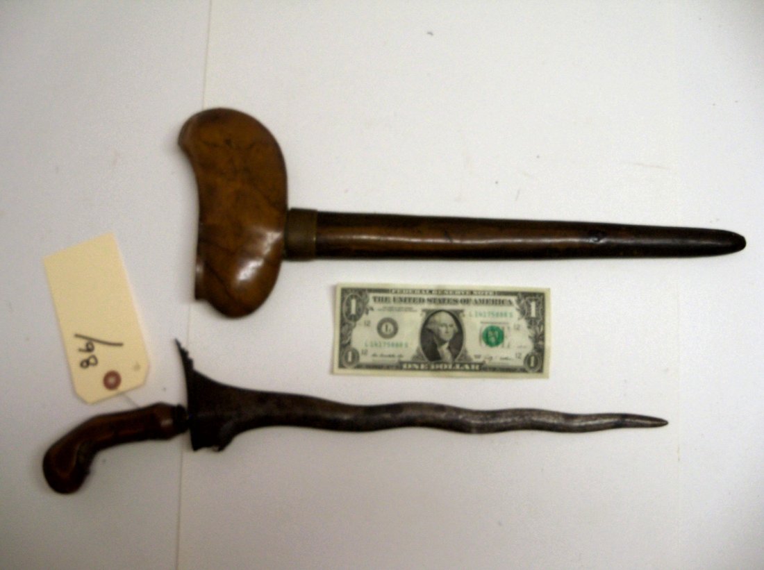 19th Century Indonesian Kris Dagger: Nicely grained original wood scabbard. 13½ inch blade.Carved handle with typical design. The William Herbert McGinty Collection. Collected between the late 1800's and early 1900's.