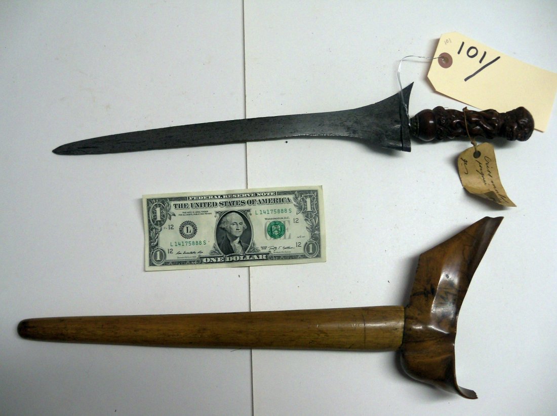 Antique 19th C. Malaysian Kris Sword Dagger: The handle is a well carved raksha or demon. It is a grotesque human figure with tusks and hair hanging down his neckin long curls. The well worn straight blade is 12 inches long. Nicely grained woode