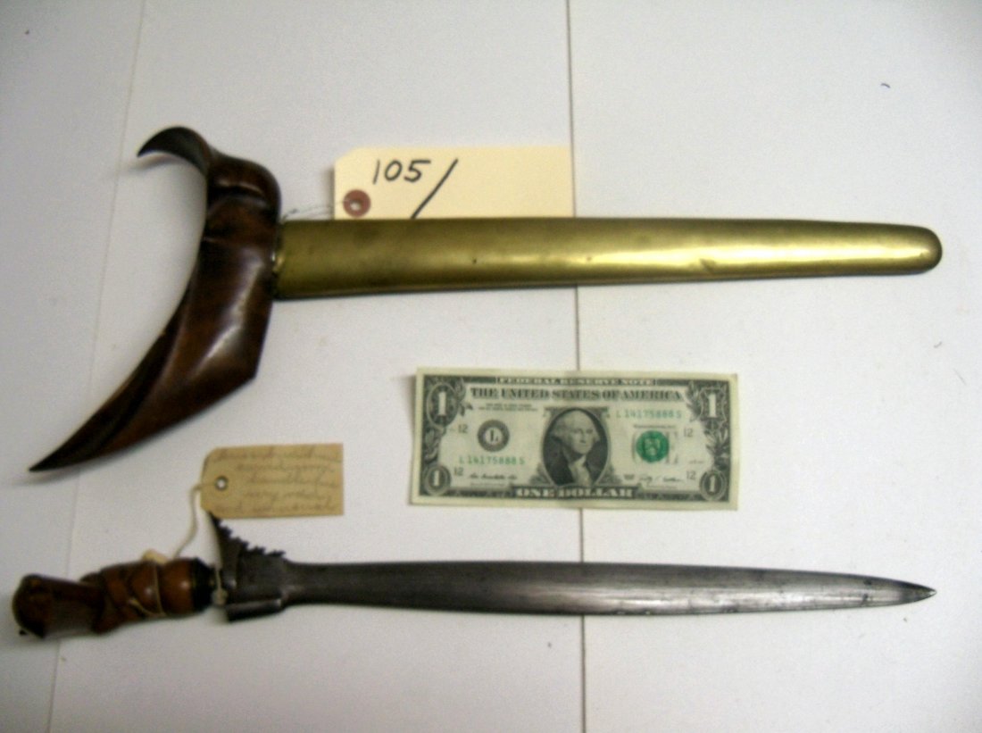 19th C. Indonesian or Malaysian Kris Dagger Sword: This example has a bird head handle and brass bound scabbard. 13 inch straight blade. The William Herbert McGinty Collection. Collected between the late 1800's and early 1900's.