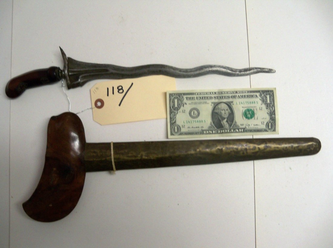 19th Century Indonesian Kris Dagger: 12 inch well worn blade. Scabbard covered with brass. William Herbert McGinty Collection. Collected between the late 1800's and early 1900's.
