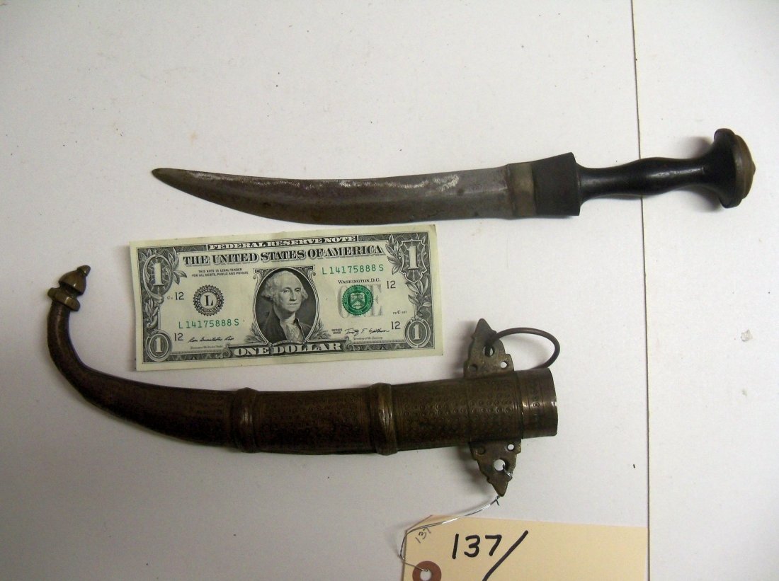 Fine 19th Century Saharan, Tuareg or Islamic Dagger: Very fine form and construction. Decorated brass scabbard. 7 inch curved blade, wood handle with metal pommel and button.