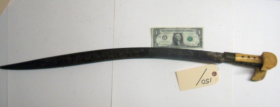19th Century Ottoman Turkish Yataghan Sword: Fine quality. 27 inch typically curved engraved blade with a gilt mount set with coral, very large bone wings..
