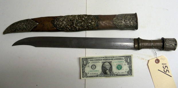 Antique 19th C. Tibetan or Sino-Mongolian Short Sword: This example features a traditional Bhutanese or Eastern Tibetan handle but is mounted in a Mongolian style scabbard of copper mounted in chased and repoussed silver. 15 inch blade. From the William H