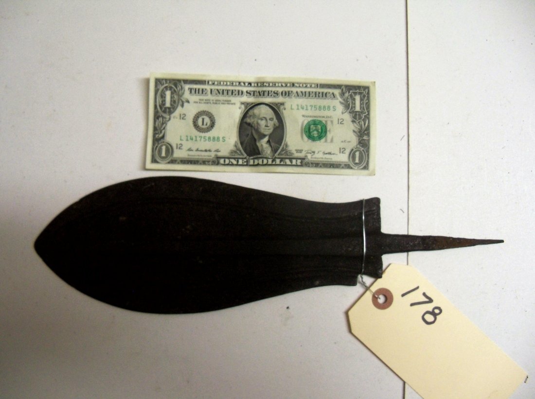Antique Iron South African Spear Head: 9¾ inches long,approx.3½ inches at it's widest point. Central rib on the blade is an extension of the tang.