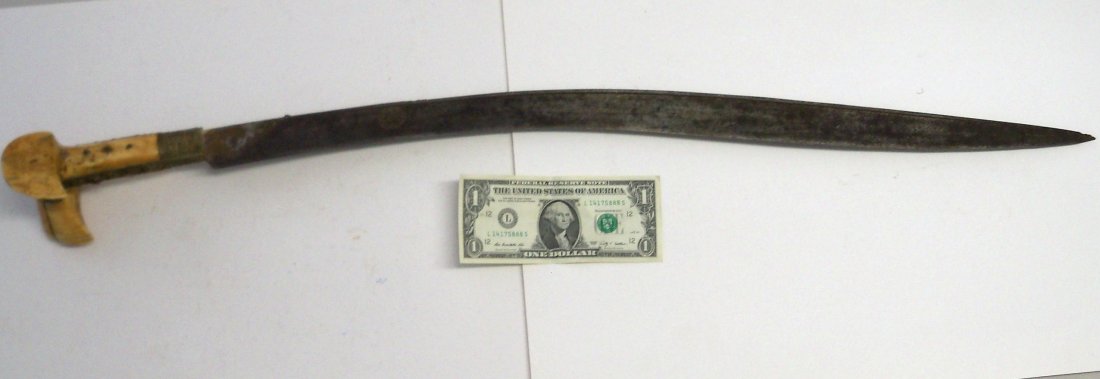 19th Century Ottoman Turkish Yataghan: Fine quality. 27 inch typically curved engraved blade with a gilt mount set with coral, very large bone wings..