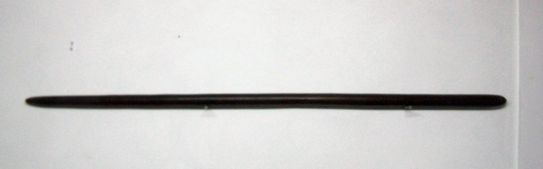 Long slender very hard wood club/staff with stamped: The William Herbert McGinty Collection. Collected between the late 1800's and early 1900's.Possible Fiji. 56" overall