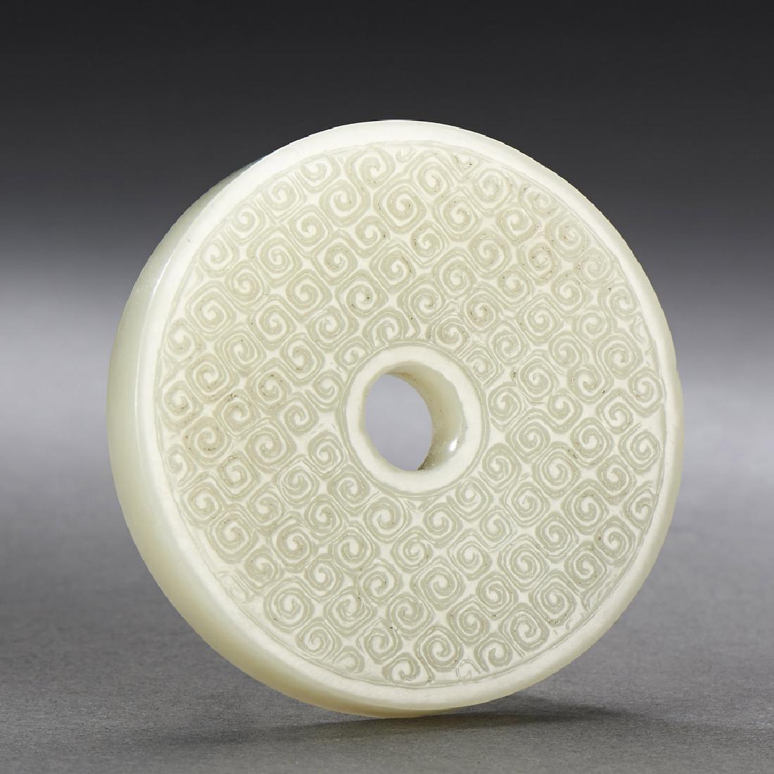 A CHINESE WHITE JADE CHI DRAGON DISC, BI (1 of 2)