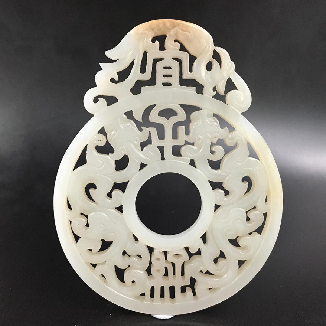 A PIERCED CHINESE JADE DRAGON PENDANT (1 of 3)