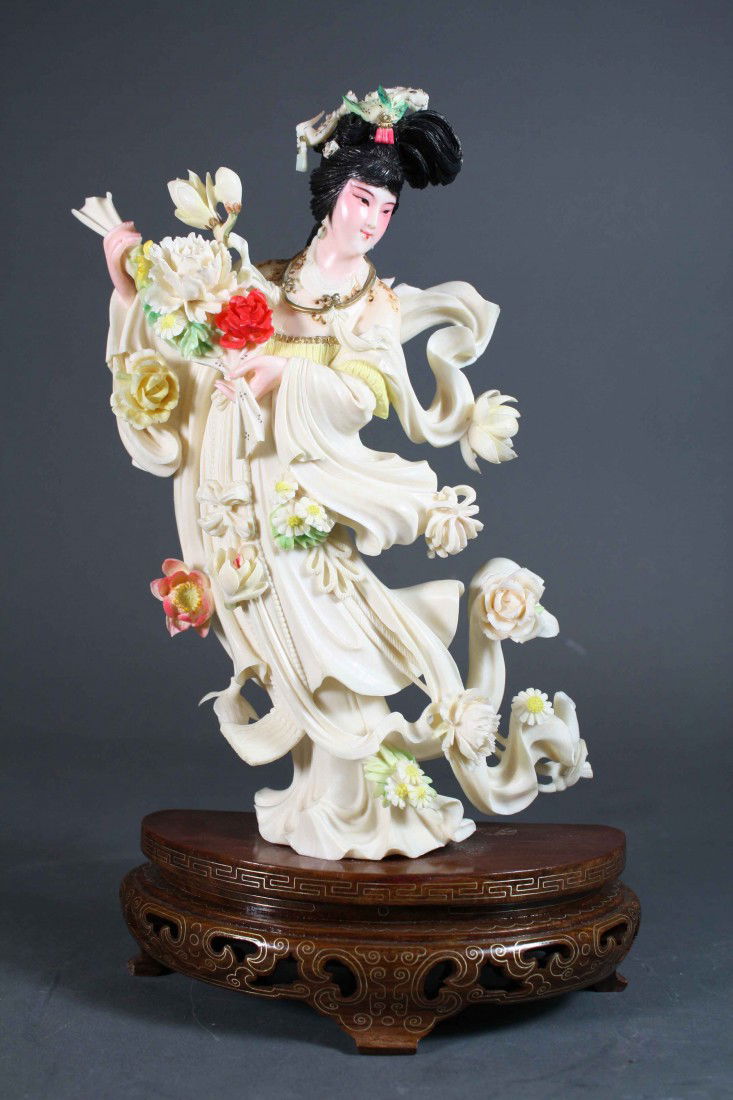 Chinese carved polychrome ivory beauty holding flo: Chinese carved polychrome ivory beauty holding flowers Very good condition 10.75 inches (without stand), 12 inches (with stand)