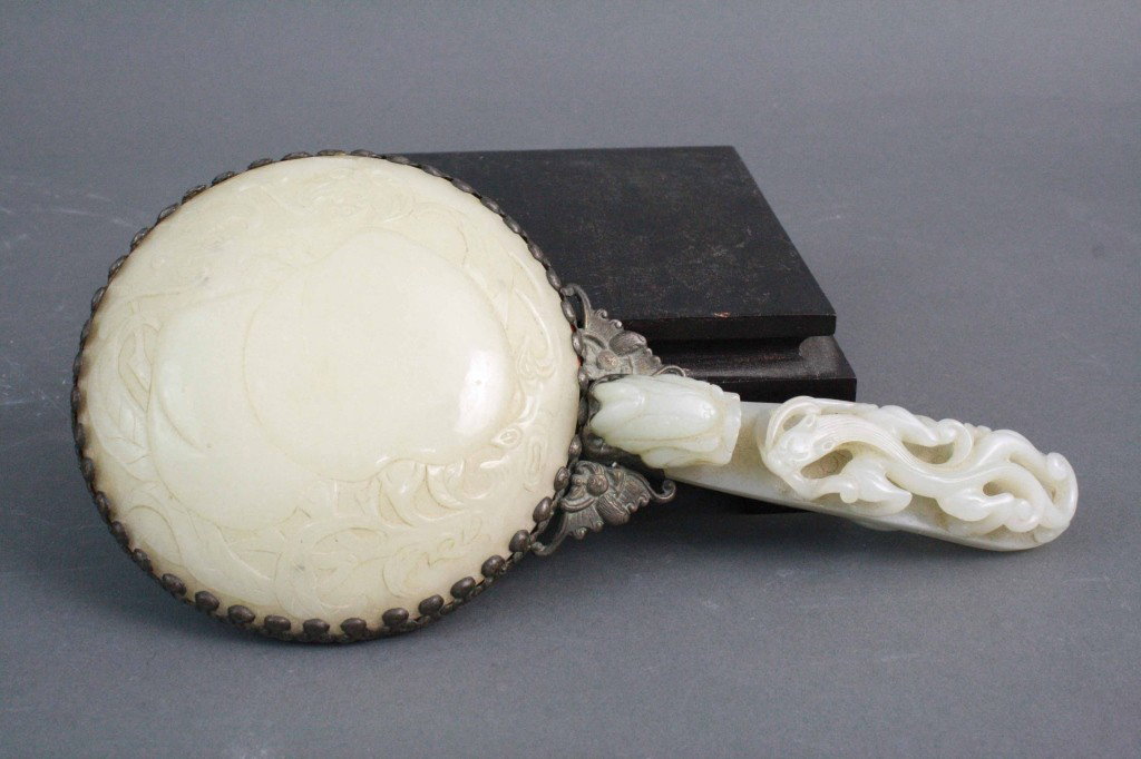 Mirror w/ Jade Dragon Belt Buckle, Jade Back Panel: Mirror w/ Jade Dragon Belt Buckle, Jade Back Panel Period: 18th/19th Century Condition: Very Good Length: 9 inches ( jade handle piece 4.5 inches) Diameter: 4.5 inches (mirror piece with jade back)