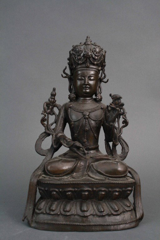 Chinese Ming Bronze Seated Buddha: Chinese Ming bronze seated Buddha on double lotus base, hand in up gesture with drape on each side. Condition: Upon RequestHeight: 10.5 inches