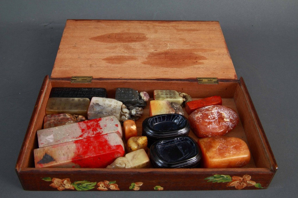A Group of Various Soapstone Seals: Collection of 15 pcs assorted soapstone seals in a wood box decorated with birds and flowers Condition: Available Upon Request Dimension: 5 1/2"L x 9 1/2"W x 1 1/2"H (Box), Seals' sizes range between 