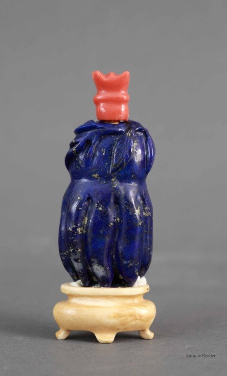 Lapis Lazuli Snuff Bottle w/ Coral and Ivory: Lapis Lazuli snuff bottle of buddha hand form with coral top and ivory base Condition: Available upon request Measurement: 3"H
