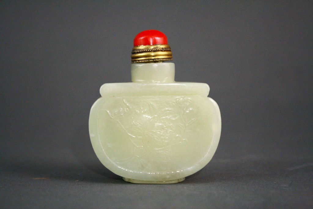Chinese Jade Snuff Bottle of Flatted Shape: Chinese jade snuff bottle of flatted shape. One side with character another fruits. Red coral top Dimension: 2 1/4"L x 2 1/2H