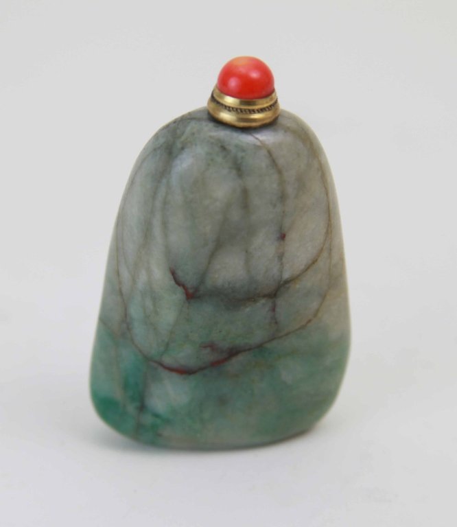 Chinese Carved Jadeite Snuff Bottle w/ Red Top: Chinese carved jadeite snuff bottle with red top Dimension: 3"H x 1 3/4"L x 3/4"W