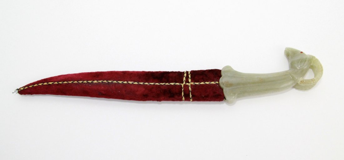 Chinese Mughal Style Jade Dagger w/ Velvet Sheath: Chinese Mughal style jade dagger with velvet sheath, the handle carved as a ram's head with precious red stone eyes Dimension: 16"L, Jade: 5 1/2"L