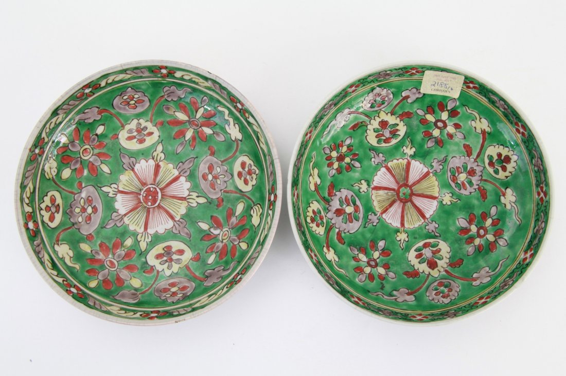 Pair of Famille Verte Dishes: Pair of Kang Xi period famille verte dishes, painted with stylized flower sprays and foliage on green grounds Provenance: Christie's London April 2006 Dimension: 8"Diam