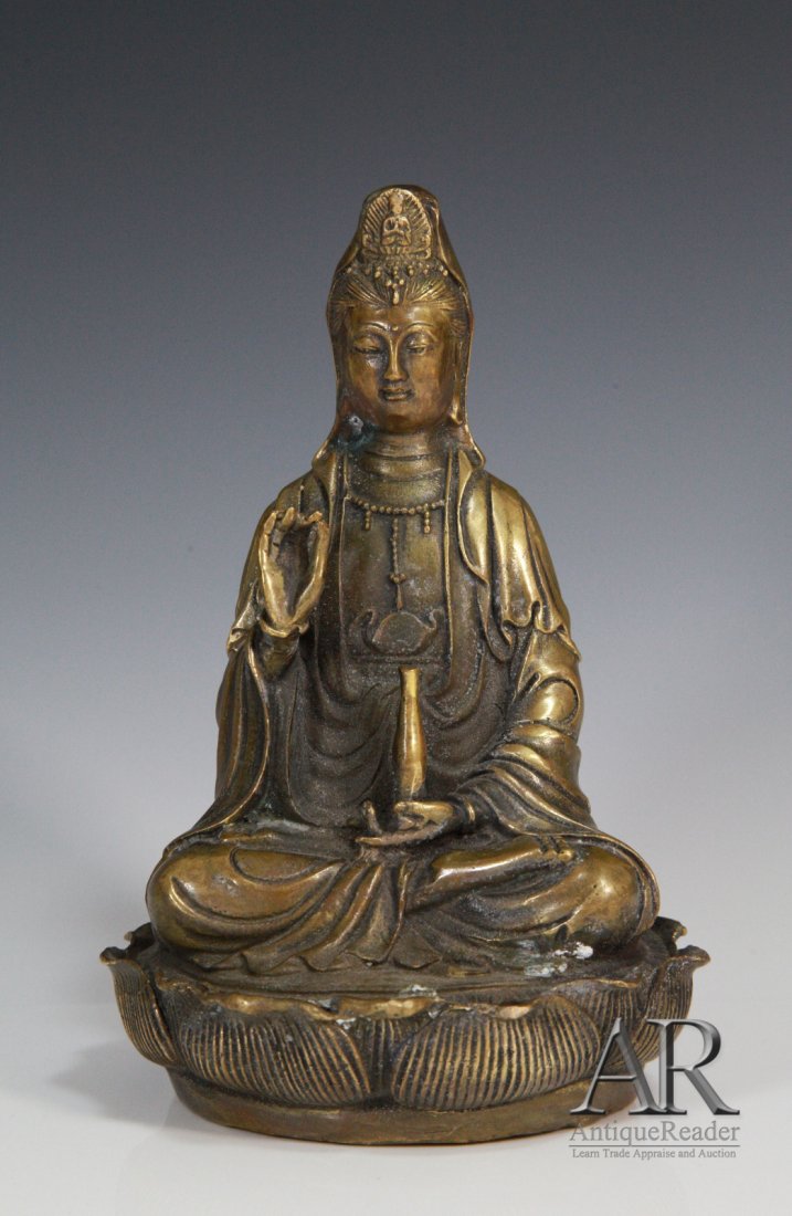 A Chinese Bronze Seating Guanyin: A Chinese Bronze Steating Guanyin Dimension: 7 1/2"H