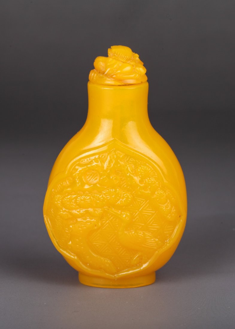 19th C. Chinese Yellow Peking Glass Snuff Bottle: Egg yolk yellow carved crane and pine tree one side, and flower tree another, with dragon stopper Dimension: 2 3/4"H