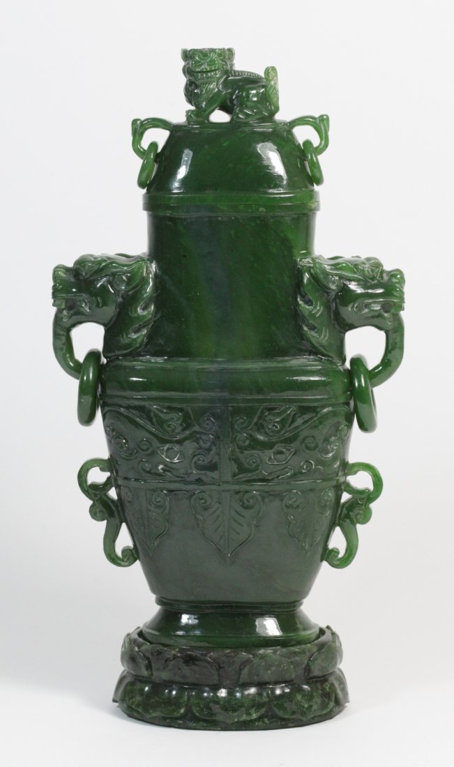 Chinese Spanish Jade w/ Archaistic Design Vase: Chinese Spanish Jade With Archaistic Design Vase and Cover, Qilin on Top, and Twin Lion Head Handles with Loose Rings on nephrite jade base Dimension: 10"H x 5 3/4"W