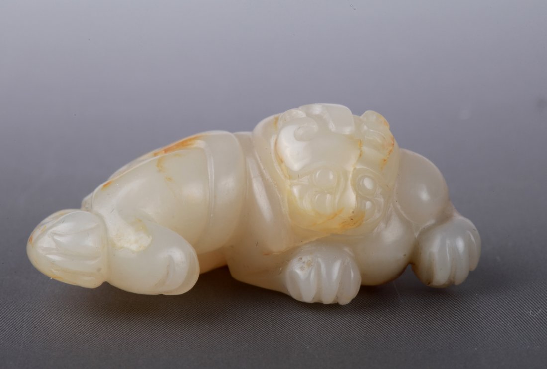 Qing Dynasty Jade Buddhistic Beast with Russet: Qing Dynasty Jade Carved Buddhistic Beast with Russet Provenance: Important Snuff Bottle and Jade Collection from Mr. Jackson, Massachusetts Dimension: 1 3/4"W