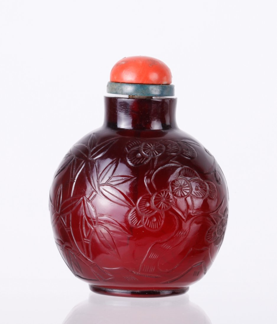 18th C. Ruby Red Glass Snuff Bottle: 18th C. Ruby red glass snuff bottlle incised with The Three Friends of Winter, pine, prunus and bamboo Dimension:3"H x 2 1/4"W