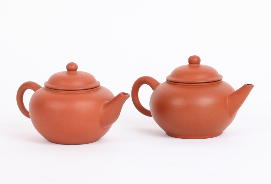 2 Pieces Chinese Yixing Zisha Teapot: 2 Pieces Chinese Yixing Zisha Teapot _x000D_ Dimension: 13.5cm (5 1/2 inch)W x 7.7cm (3 inch) H