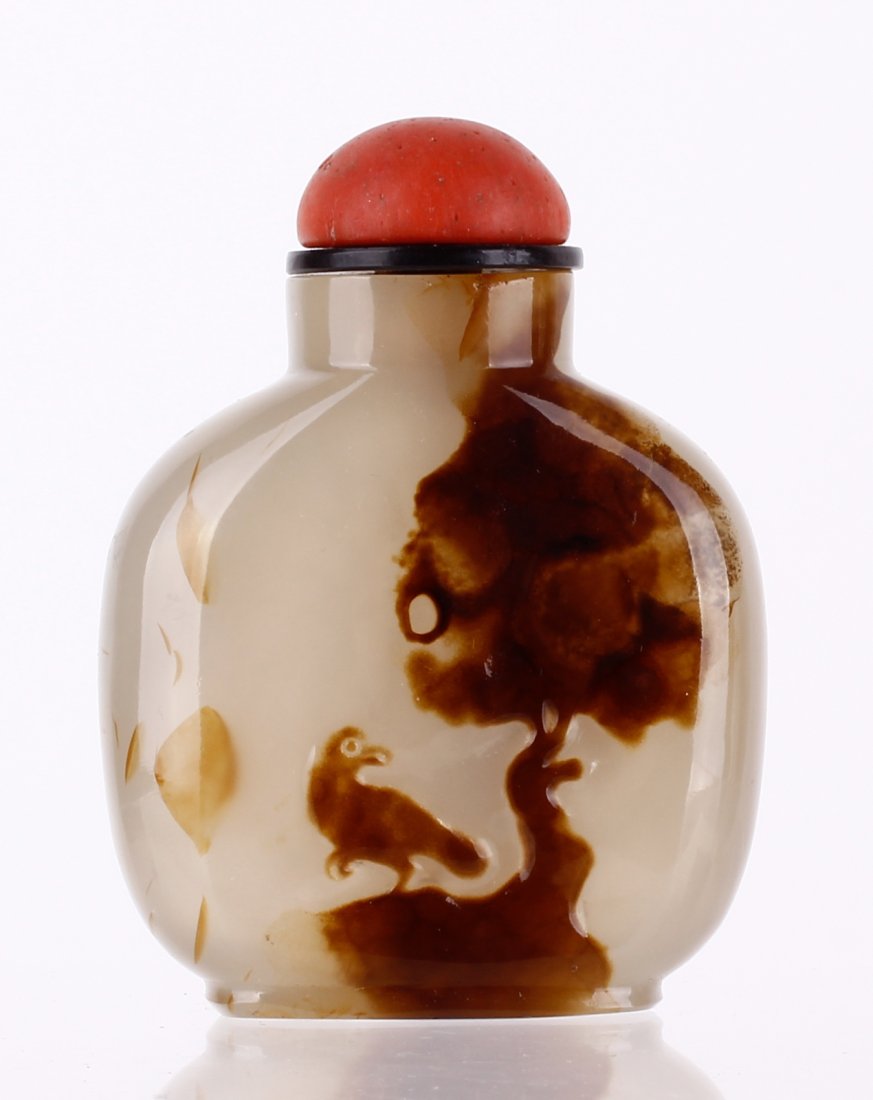 Fine Chinese Carved Agate Snuff Bottle: A very well carved Chinese shadow agate snuff bottle with red plastic stopper. from a gentlemen of international snuff bottle association called " Gerd Lester"Dimension: 2 5/8 inches high by 2 inches 