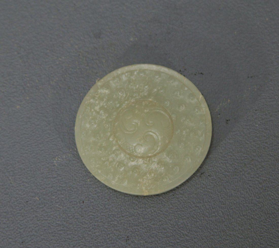 A Fine White Jade Sword Pommel (1 of 2)